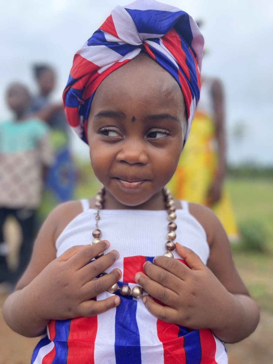 A young girl in traditional Liberian dress